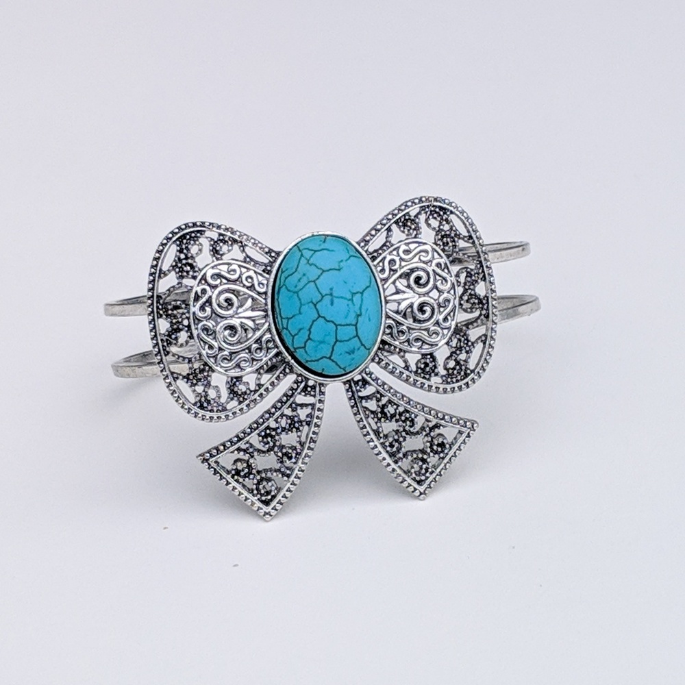 Turquoise silver tone "bow" cuff bracelet